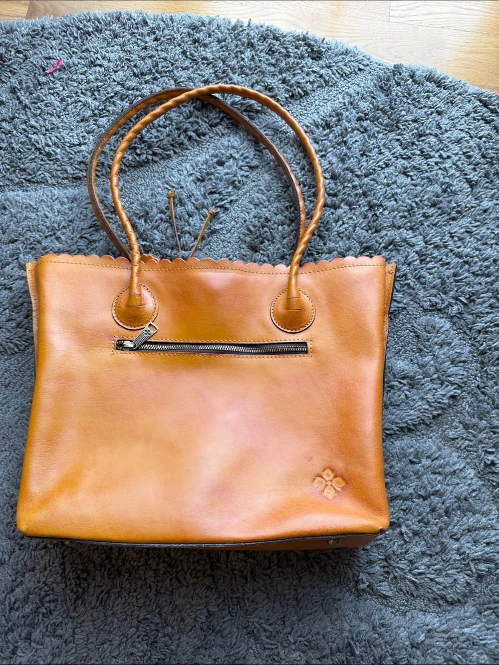 Adeline tote in a cognac burnished cutout tooled leather